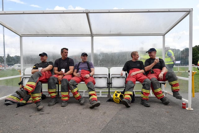 Exhausted fire fighters took a well earned break after working on the reservoir for hours on end