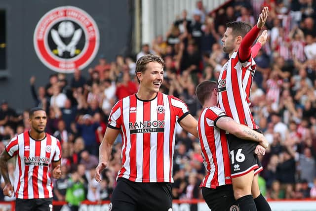Ollie Norwood is hoisted aloft after scoring Sheffield United's stunning first against Blackburn Rovers: Lexy Ilsley / Sportimage