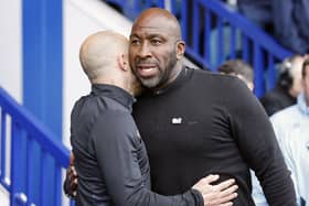 Darren Moore embraces Paul Warne ahead of their clash at Hillsborough: Richard Sellers/PA Wire.