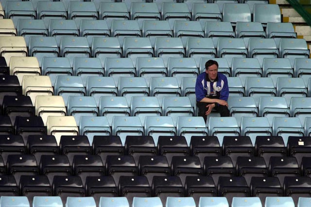 A fan cuts a disconsolate figure after watching the relegation-threatened Owls slip to a 4-1 defeat at Coventry City in May 2000.