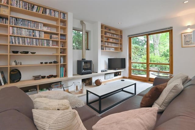 Located just next door to the music room is this cosy sitting room, which gives you direct access to the properties brilliantly landscaped grounds.
