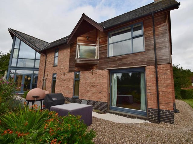 Let's step back outside now and catch another glimpse of the rear of the property as it stands proud on Windmill Hill in Oxton.