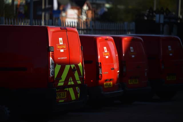Royal Mail vans are seen outside a Delivery Office (Photo by Nathan Stirk/Getty Images)