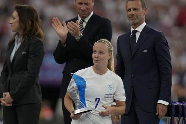 England's Beth Mead walks away with her Player of the Tournament award after winning the Women's Euro 2022 final soccer match between England and Germany at Wembley stadium in London, Sunday, July 31, 2022. England won 2-1. (AP Photo/Alessandra Tarantino)