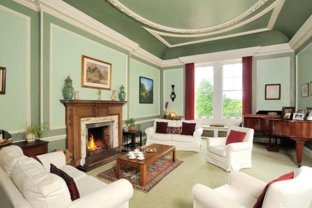 The grand living room is very generous in size, providing enough space for family and entertaining guests, and boasts a large fireplace at its heart for a cosy feel.
