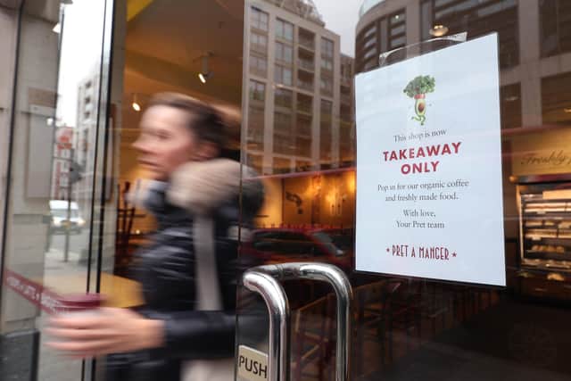 A sign in the window of a Pret A Manger in London, telling customers the seating area is closed and the store is takeaway service only due to coronavirus. Picture: Yui Mok/PA Wire.