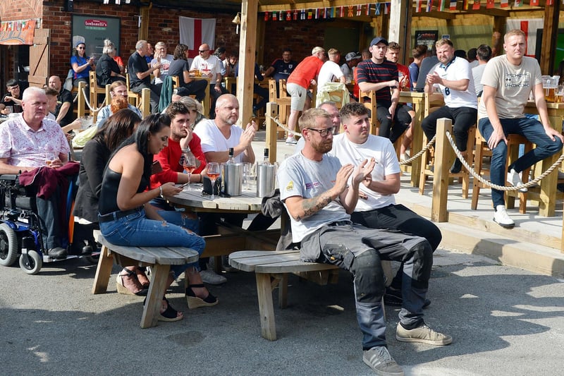 Fans in Chesterfield watch the England v Germany game at the Spotted Frog.