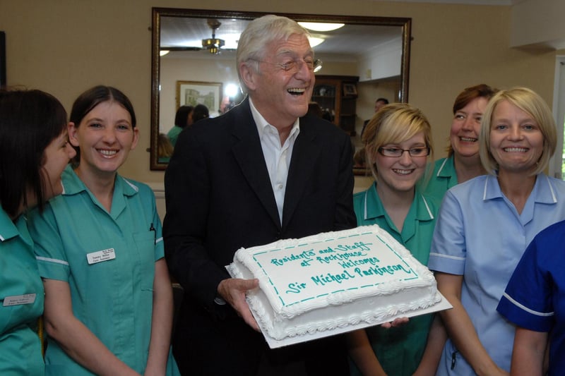 Sir Michael Parkinson, National Dignity Ambassador during his visit to the Rock House Care Home, Tickhill, near Doncaster with staff and cake  in 2008