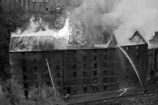 Fire destroys the warehouse of theatrical costumiers William Mutrie & Son, Dean Village's Bells Brae, in May 1957.