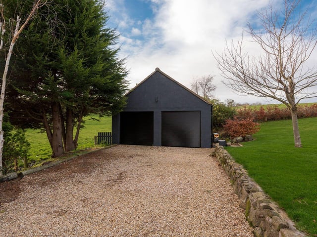 The property includes a double garage, which is currently being used as a home gym