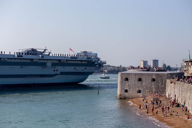 People watch from the Hot Walls as HMS Queen Elizabeth sails out of Portsmouth. Picture: Habibur Rahman