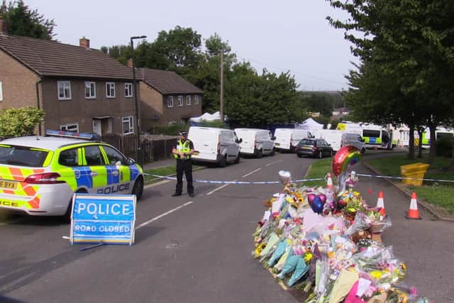 Flowers near to the scene in Chandos Crescent, Killamarsh, near Sheffield, where the bodies of John Paul Bennett, 13, Lacey Bennett, 11, their mother Terri Harris, 35, and Laceyâ€™s friend Connie Gent, 11, were discovered at a property on Sunday morning. Picture date: Tuesday September 21, 2021. PA Photo. See PA story POLICE Killamarsh. Photo credit should read: Dave Higgens/PA Wire