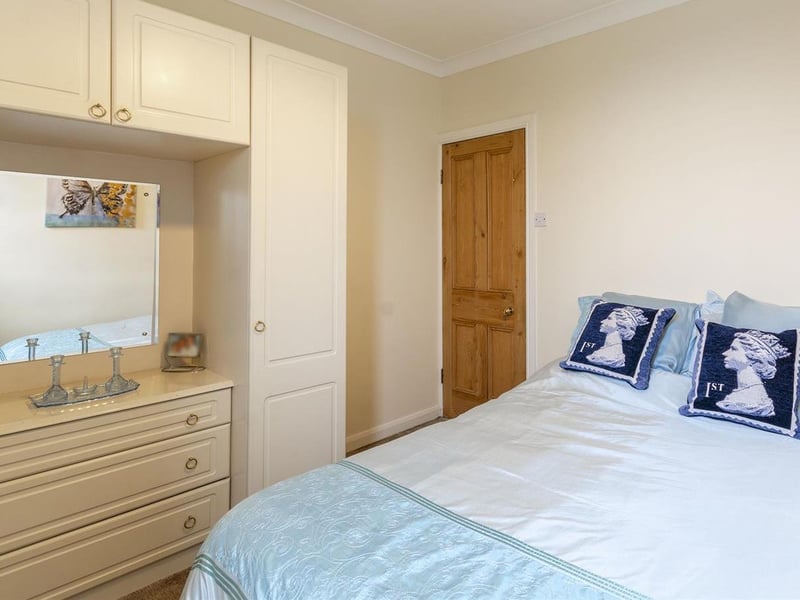 With carpet to flooring, central heating radiator, cupboard for additional storage and window to the side elevation.