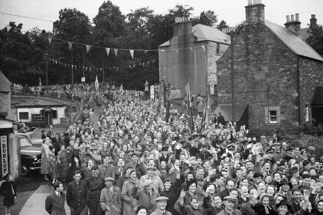 Selkirk Common Riding, June 1954. Crowds flock down to the green.