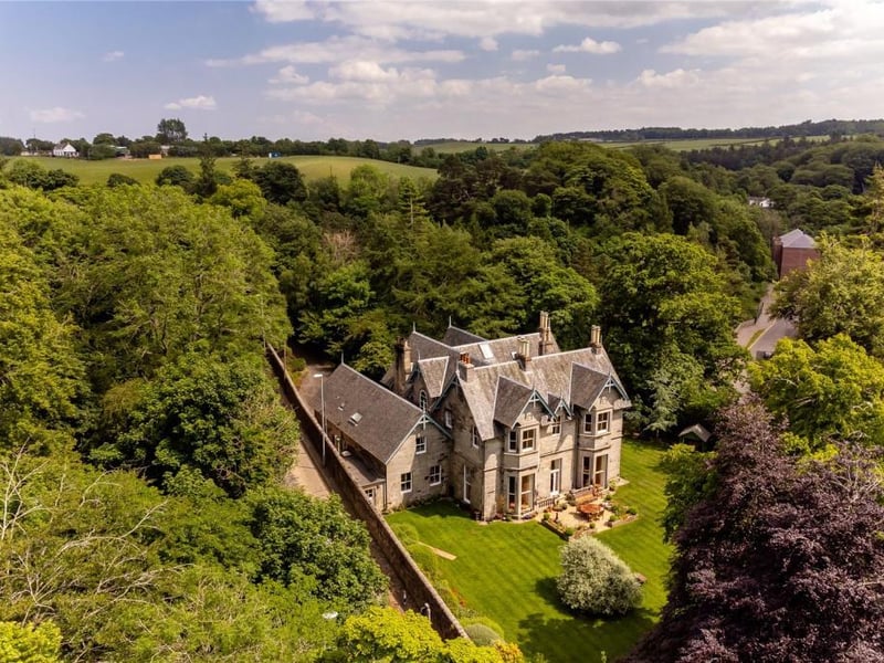 Aerial view of house and gardens.