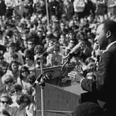 Black civil rights movement leader Rev Dr Martin Luther King speaks to a huge protest