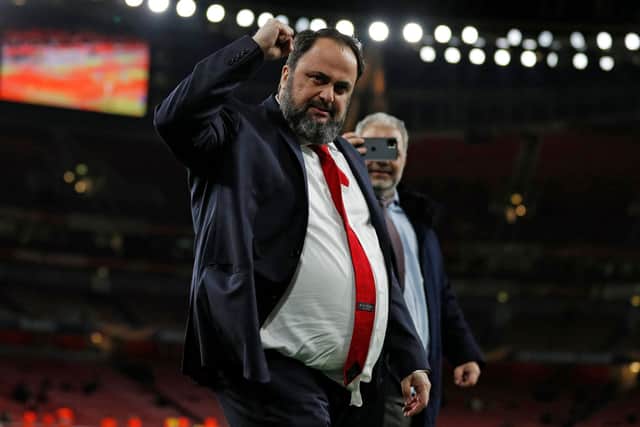 Olympiakos' president Evangelos Marinakis (C) also owns Nottingham Forest: ADRIAN DENNIS/AFP via Getty Images