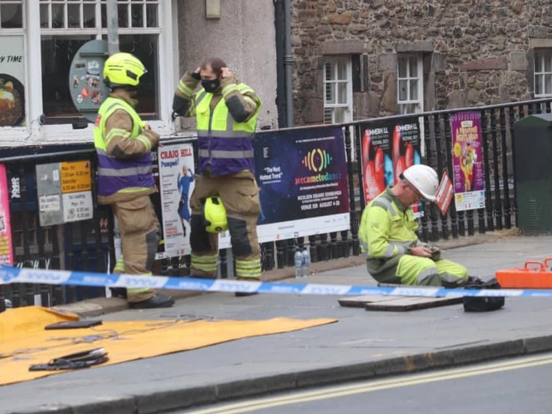 Crews wait for further instruction near Greyfriars Bobby.