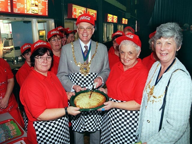The Lord and Lady Mayoress of Sheffield officially launched the Myers Grove School's new fast food restaurant called The Pit Stop. Seen is the Lord Mayor as he cuts the first Pizza and with him is Pam Lawson, the cook supervisor, and Christine Arthur, October 1999