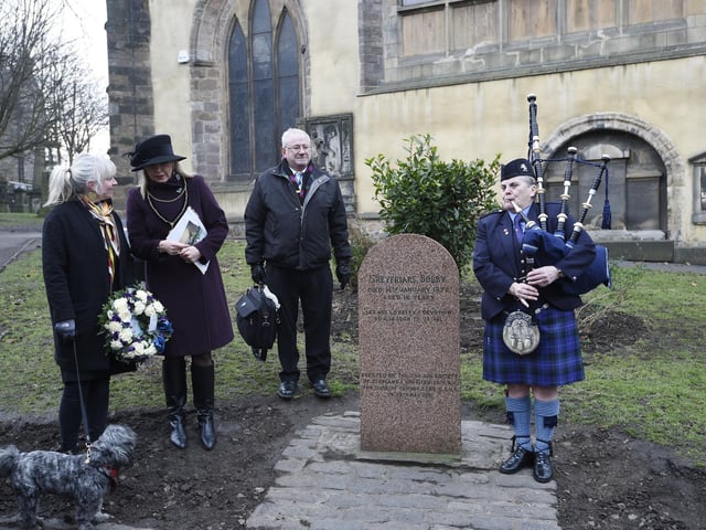 Hannah Winton (4), Bob the dog, and City Tours Edinburgh actors Dave Severn and Caroline Walker, attend a ceremony to mark the anniversary of the death of Greyfriars Bobby in January 2018.