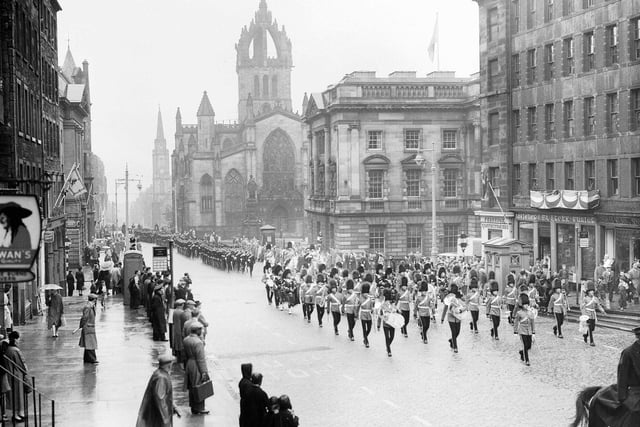 The Royal Mile has lived up to its name - with a number of regal processions taking place on its cobbles over the years. The Scots Greys are pictured marching up the street in honour of Queen Elizabeth II and Prince Philip Duke of Edinburgh's visit during their tour of Scotland in July 1956.