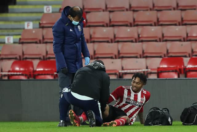 Antwoine Hackford of Sheffield United receives medical treatment: Isaac Parkin / Sportimage