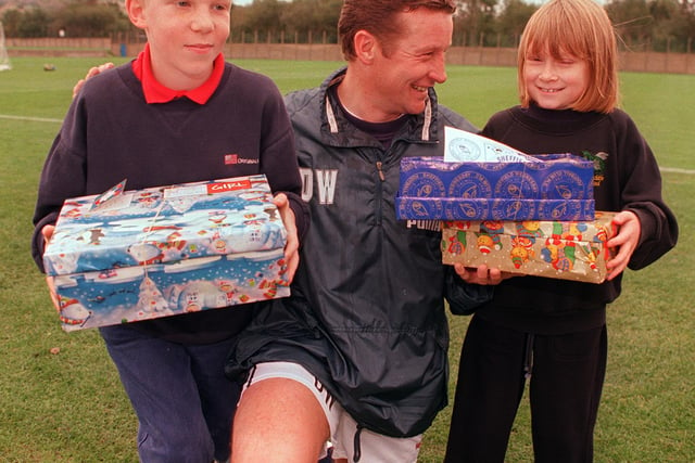 Wednesday manager Danny Wilson helps to launch the Samaritans Purse and Operation Christmas Child for needy children in Eastern Europe appeal with Paul Renner, nine, and eight-year-old Hannah Croft in the late 90s.