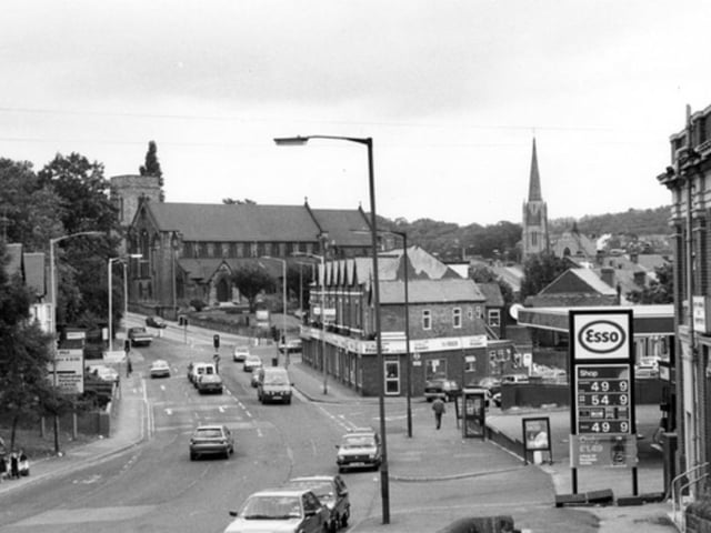 Barnsley Road in Fir Vale, Sheffield, at the junction with Skinnerthorpe Road, looking towards St. Cuthberts Church (left) and the spire of Trinity Methodist Church, in July 1993