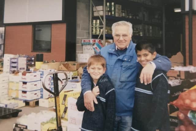 Abujee with his grandsons back in the days of the wholesale market business