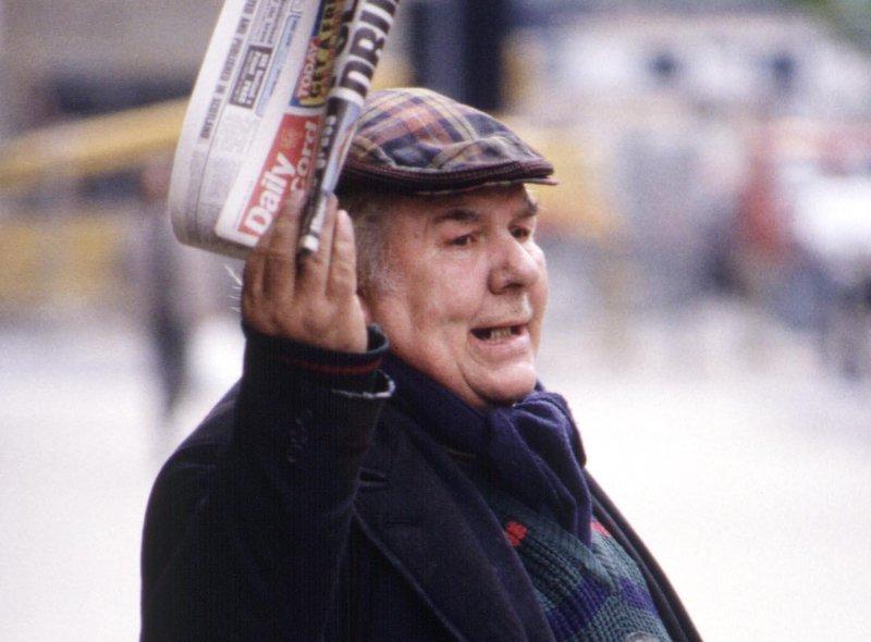 A Glasgow man in a tartan bunnet selling the Daily Record in August 1990.