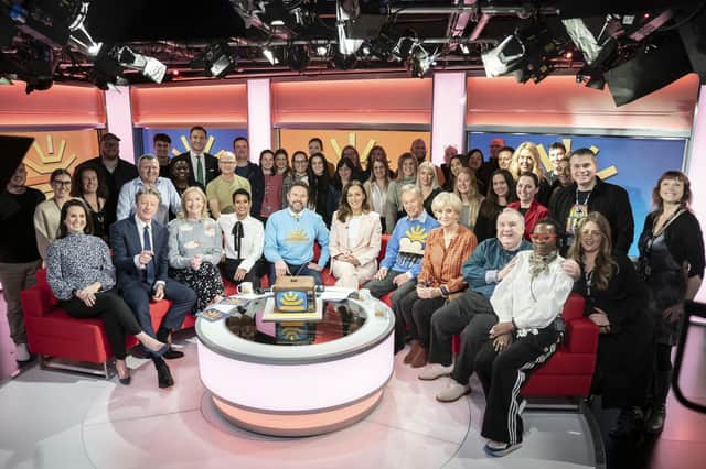BBC crew with front (left to right) Nina Warhurst, Charlie Stayt, Carol Kirkwood, Naga Munchetty, Jon Kay, Sally Nugent, Francis Wilson, Debbie Rix and Russell Grant on the red sofa as BBC Breakfast celebrate its 40th anniversary with a special show and guests at MediaCityUK, Salford. Photo credit: Danny Lawson/PA Wire