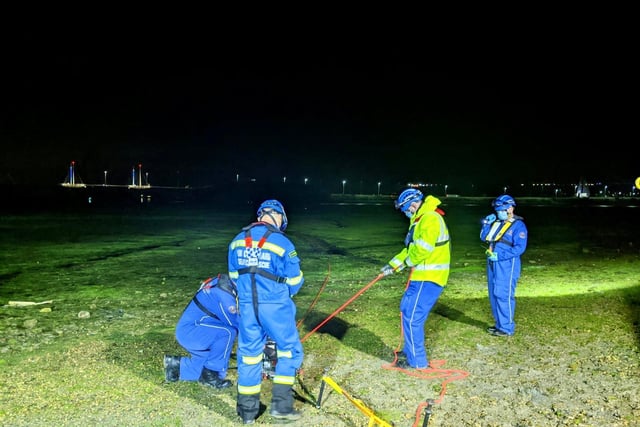 A crew from the Hill Head Coastguard helping to rescue two women stuck in the mud in Hilsea