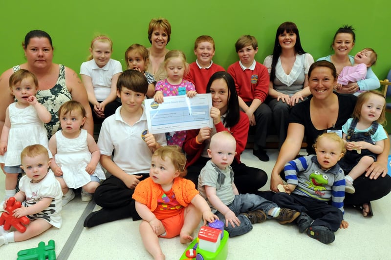 A parent and toddler group which took part in the Smile Challenge 8 years ago. Can you spot someone you know?