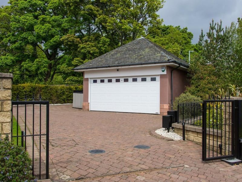 Gated entrance and double garage.