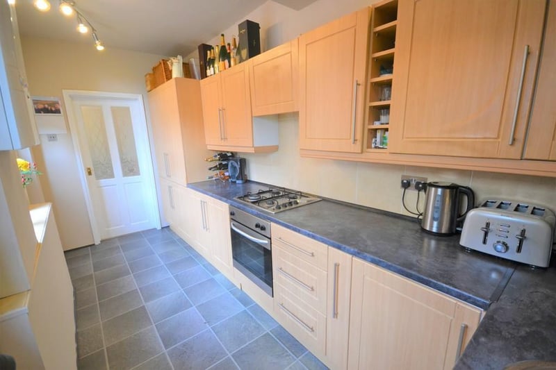 Well presented kitchen having an excellent range of oak effect wall and base units with contrasting roll top work surfaces and splashback wall tiles. Integrated oven, gas hob with extractor fan, built in fridge freezer.  A stable type wooden door opens to the rear garden.