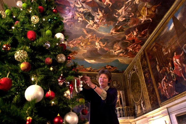 Victorian Christmas at Chatsworth House, Derbyshire, head housekeeper Christine Robinson decorating a tree in the Painted Hall in 2003