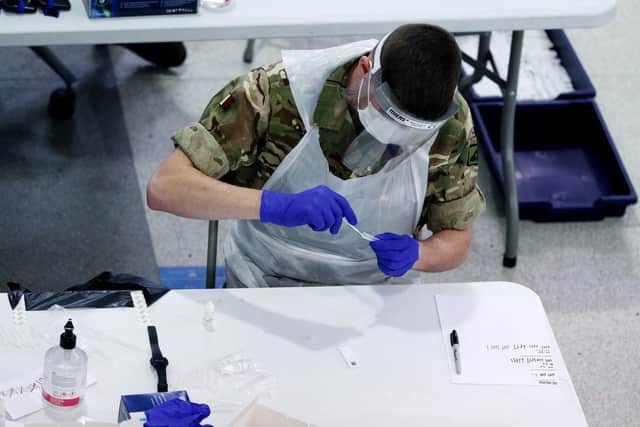 Soldiers carry out mass coronavirus testing in St Johns Market, Liverpool during the four week national lockdown to curb the spread of coronavirus in England. Photo: Peter Byrne/PA Wire