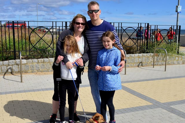 Paula, Scott, Holly and Erin Mitchell with their dog Nelson.