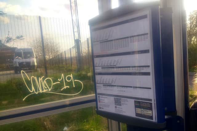 'COVID-19' graffiti at a bus stop on Spencer Road in Heeley, Sheffield