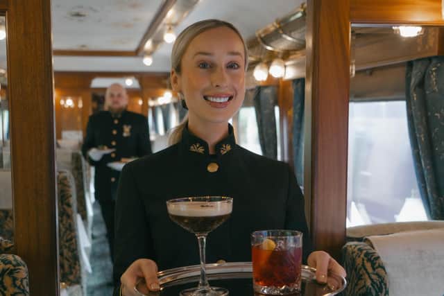 Cocktail time … a Northern Belle steward serves a Martini and a Negroni. Photo: CAMERON PITTS
