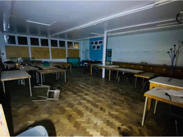 Desks and chairs are still strewn around classrooms.