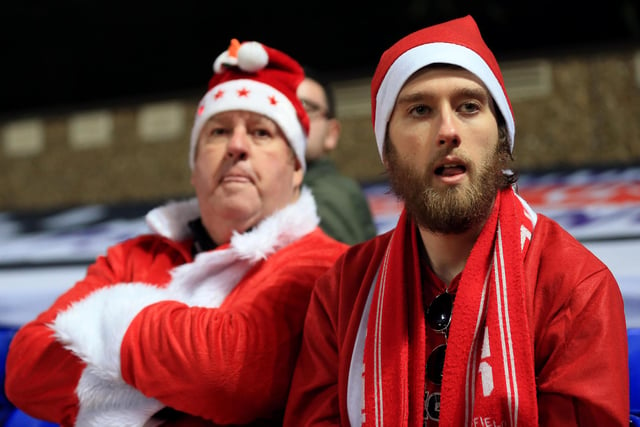 United fans dressed as Santa Claus look on during the Sky Bet Championship match at Ipswich Town in December 2018.