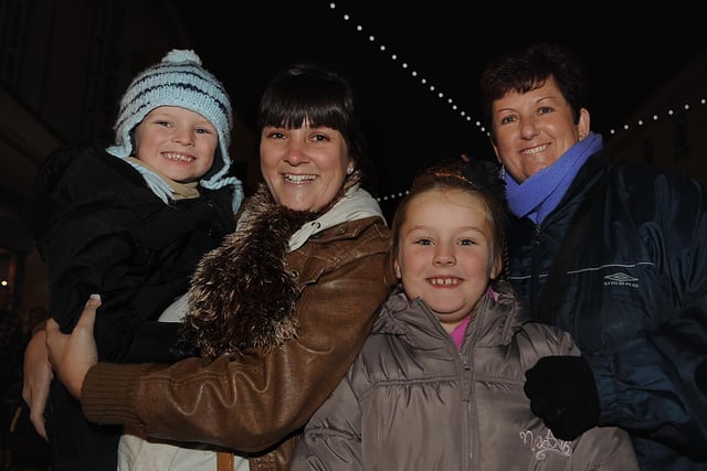 Sam Clarke from Leigh Park with her children Freddie (four), and Mollie (seven), and grandmother Julie Williams (right) watch the Christmas lights switch on in Commercial Road in 2009. Picture: Ian Hargreaves  (094172-5)