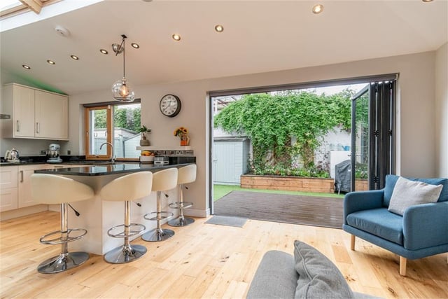 Kitchen / sitting area with bi-fold doors out to garden.