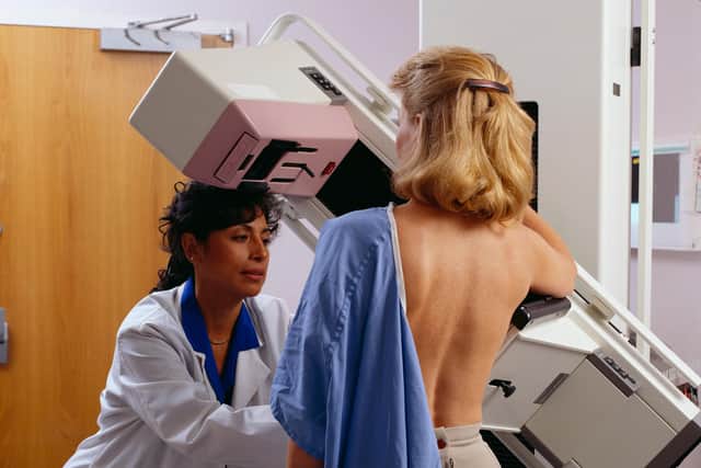 Woman undergoing mammogram testing