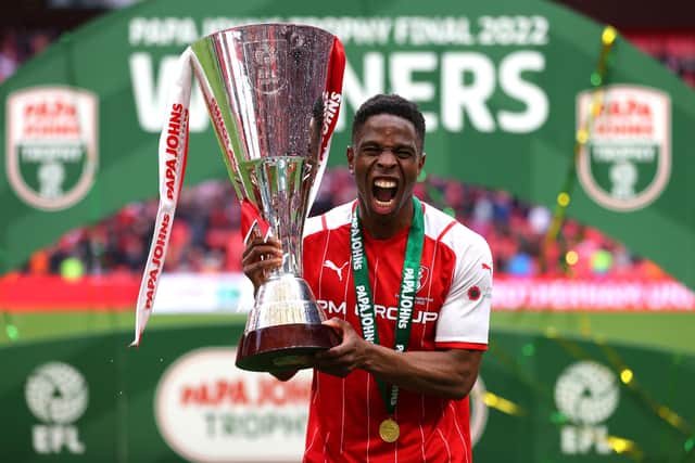 Chiedozie Ogbene of Rotherham United celebrates with the Papa John's Trophy following victory in the final (photo by Catherine Ivill/Getty Images).