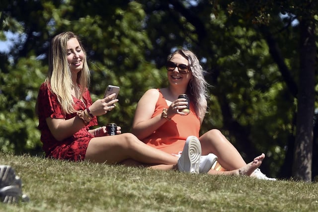 These two girls are all smiles as they soak up the sunshine at Inverleith Park.