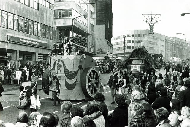 A giant chariot is followed by a smoking volcano as the procession wends its way down High Street in the 1973 Sheffield University Rag Parade, October 27, 1973