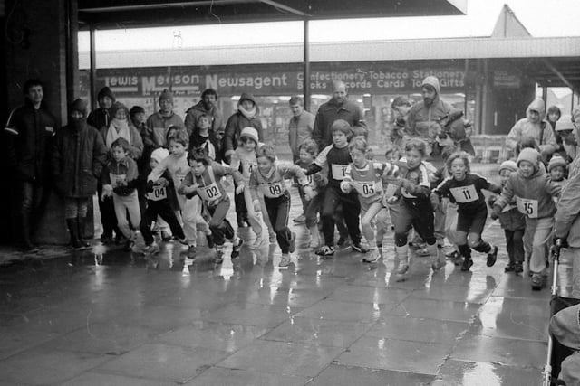 This looks like a competitive, rainy fun run! Spot anyone you know?