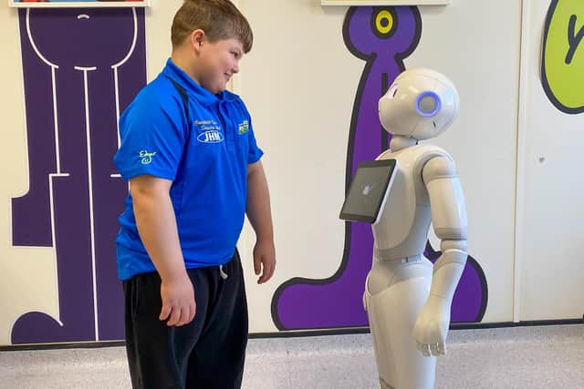 10-year-old Brandon from Barnsley meets Pepper the robot at Sheffield Children's Hospital.